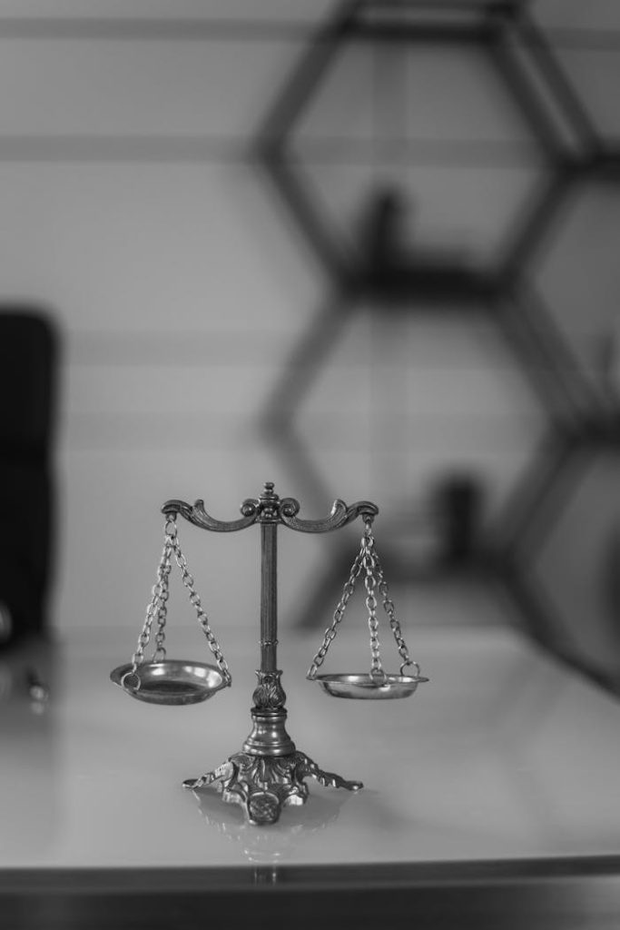 a-grayscale-of-a-balance-scale-6077519